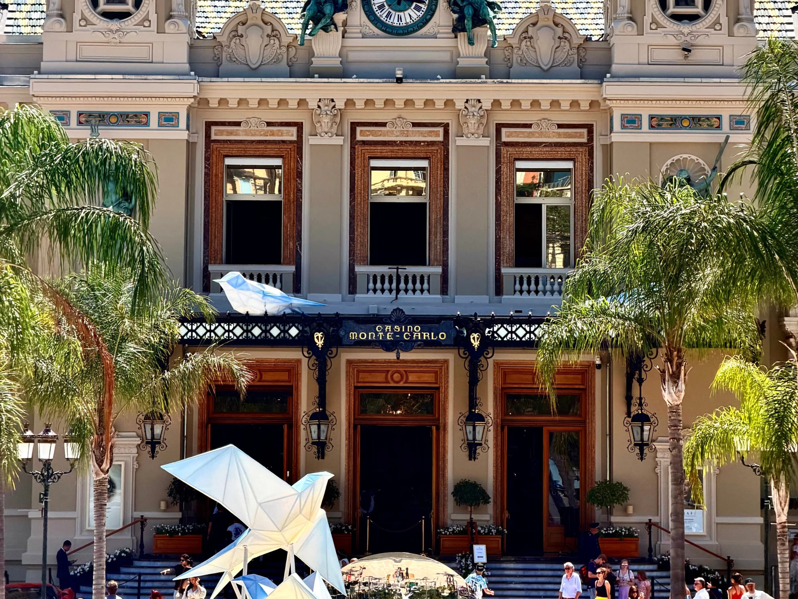 The Casino de Monte-Carlo, its Belle Époque frontage and clock towers seen from the square.