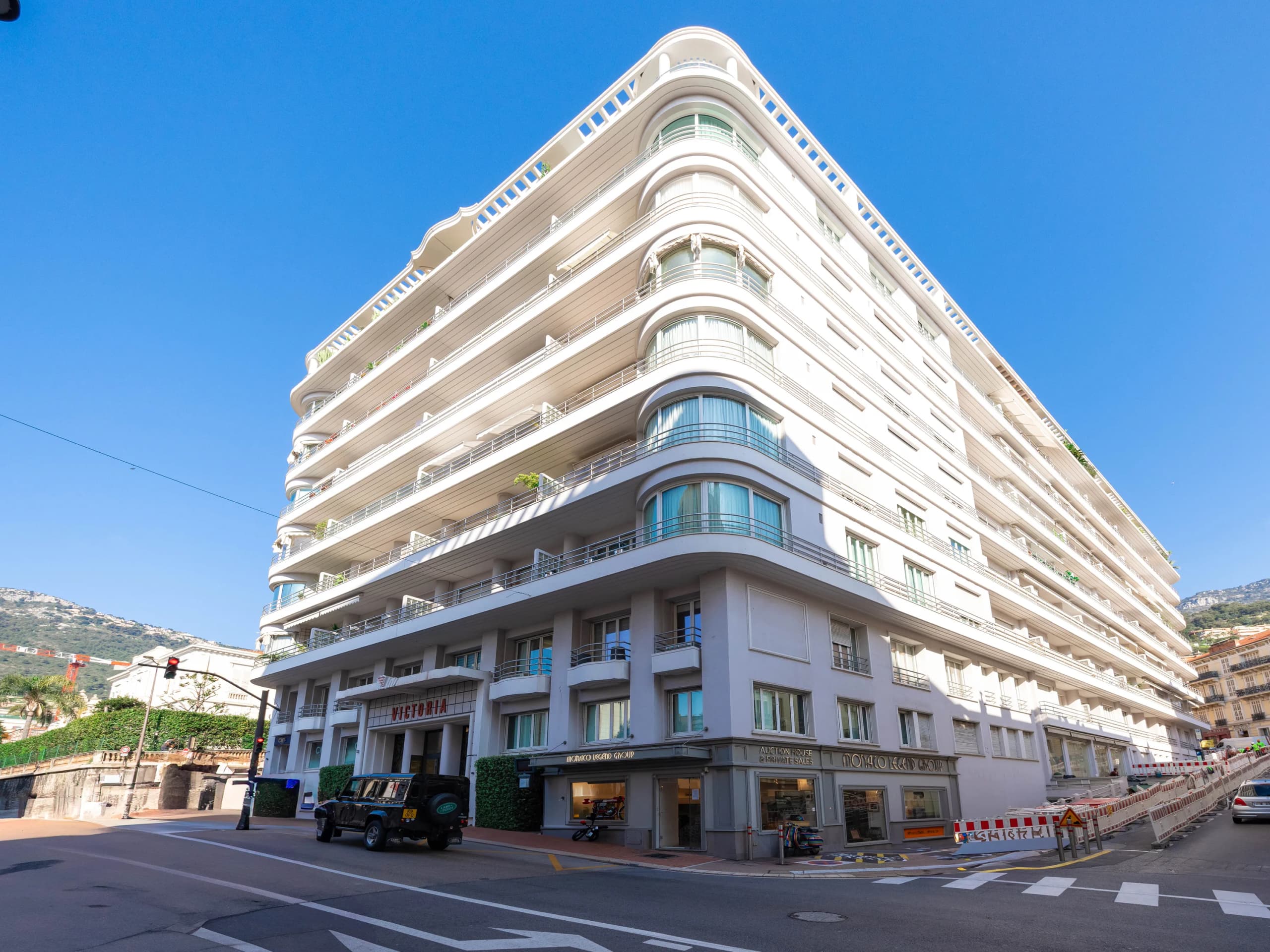 A Monaco street frontage with commercial units at ground level beneath the apartments above.