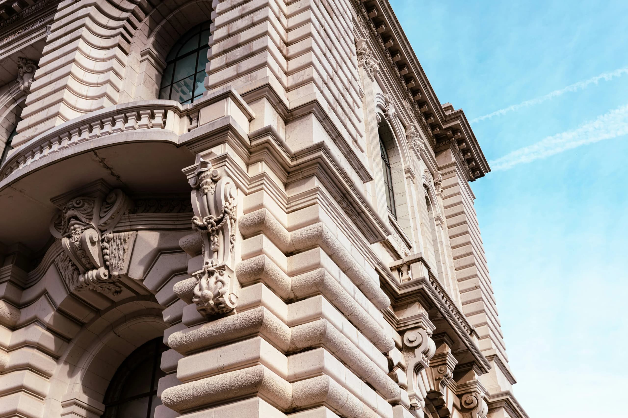 A carved stone Monaco facade seen from the street.